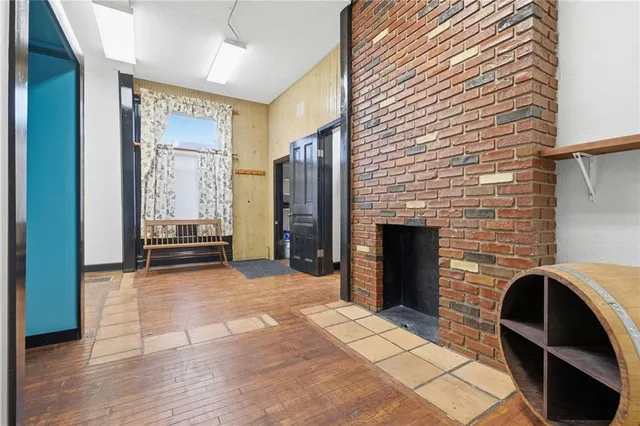 a view of room with furniture and a fireplace