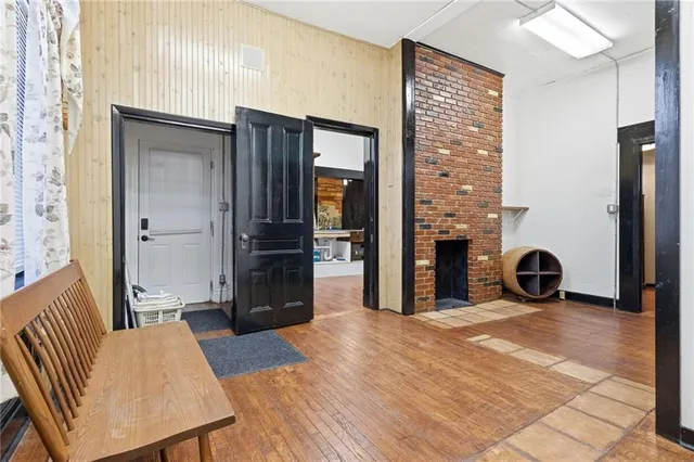 a view of a livingroom with furniture and a fireplace