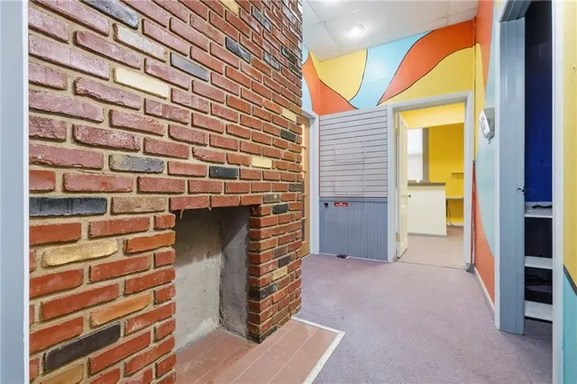 a view of an empty room and a window