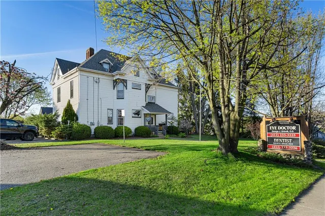 a front view of a house with garden