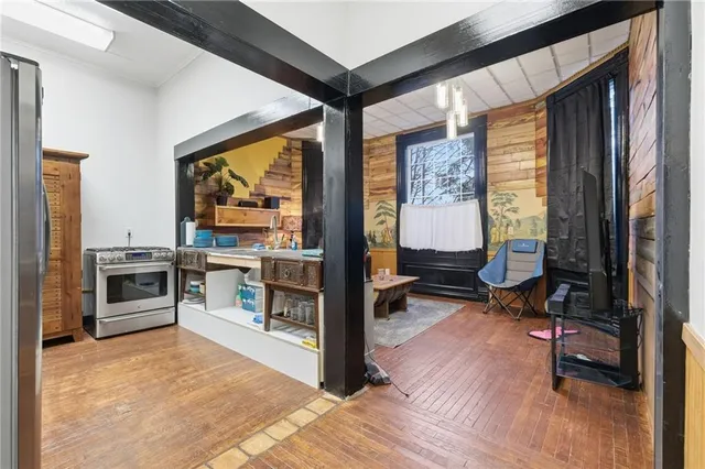 a view of a livingroom with furniture and a kitchen