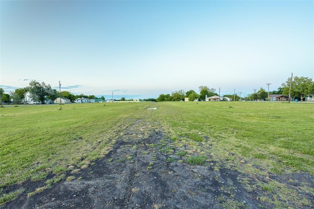 102 East Hubbard Road Josephine, TX 75173 - Photo 6 of 10 a view of a grassy field with trees