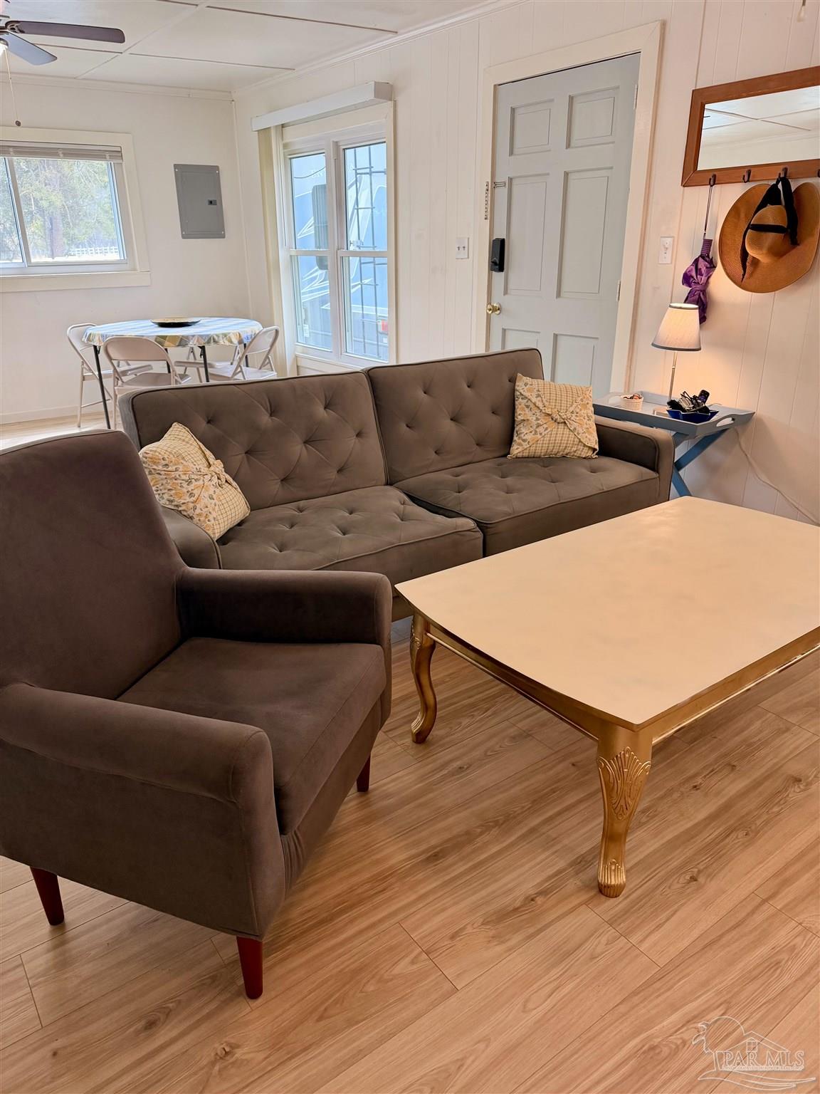 8816 Gibson Road Molino, FL 32577 - Photo 13 of 61 a living room with furniture and a wooden floor