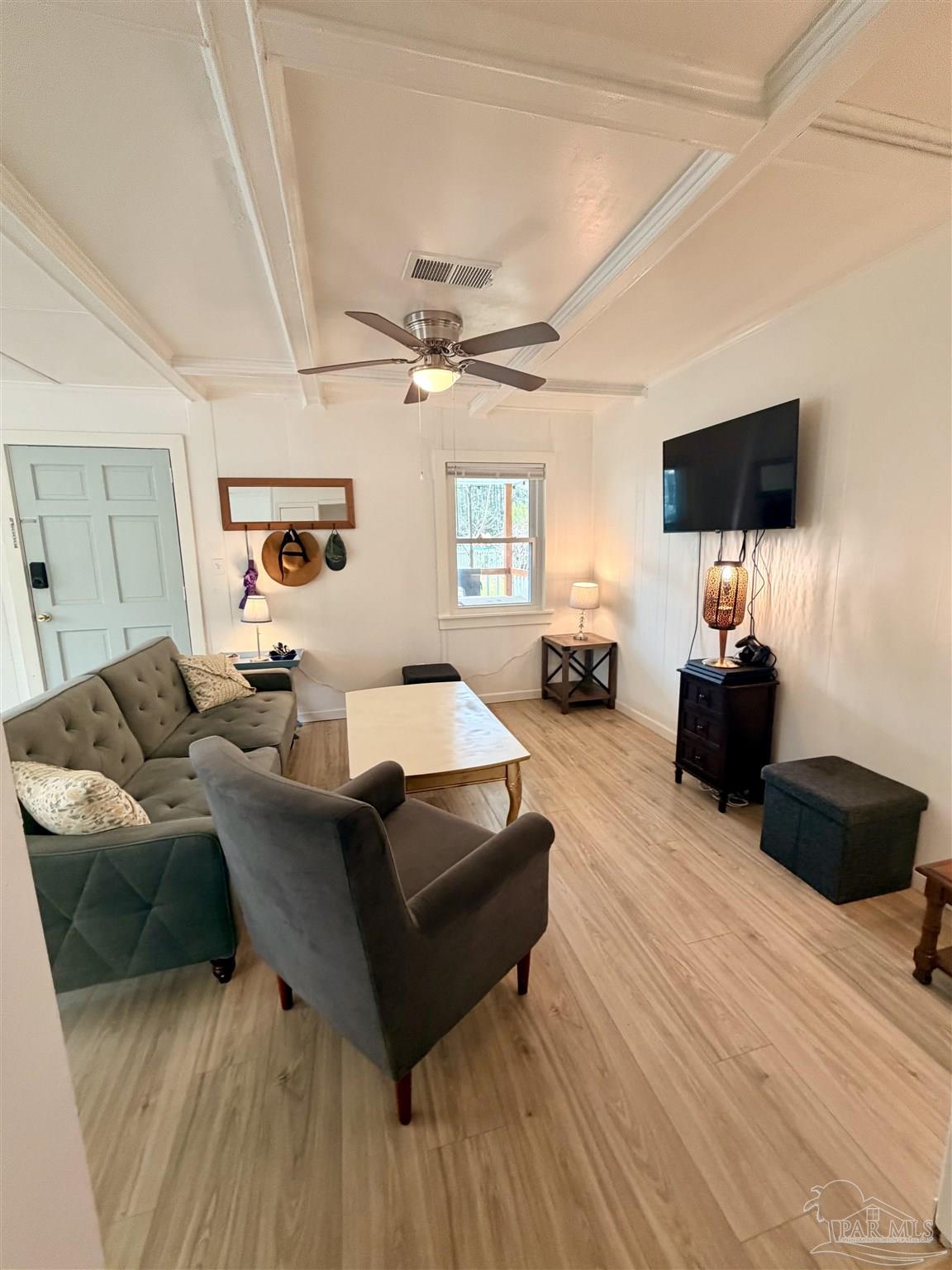 8816 Gibson Road Molino, FL 32577 - Photo 15 of 61 a living room with furniture a ceiling fan and a wooden floor