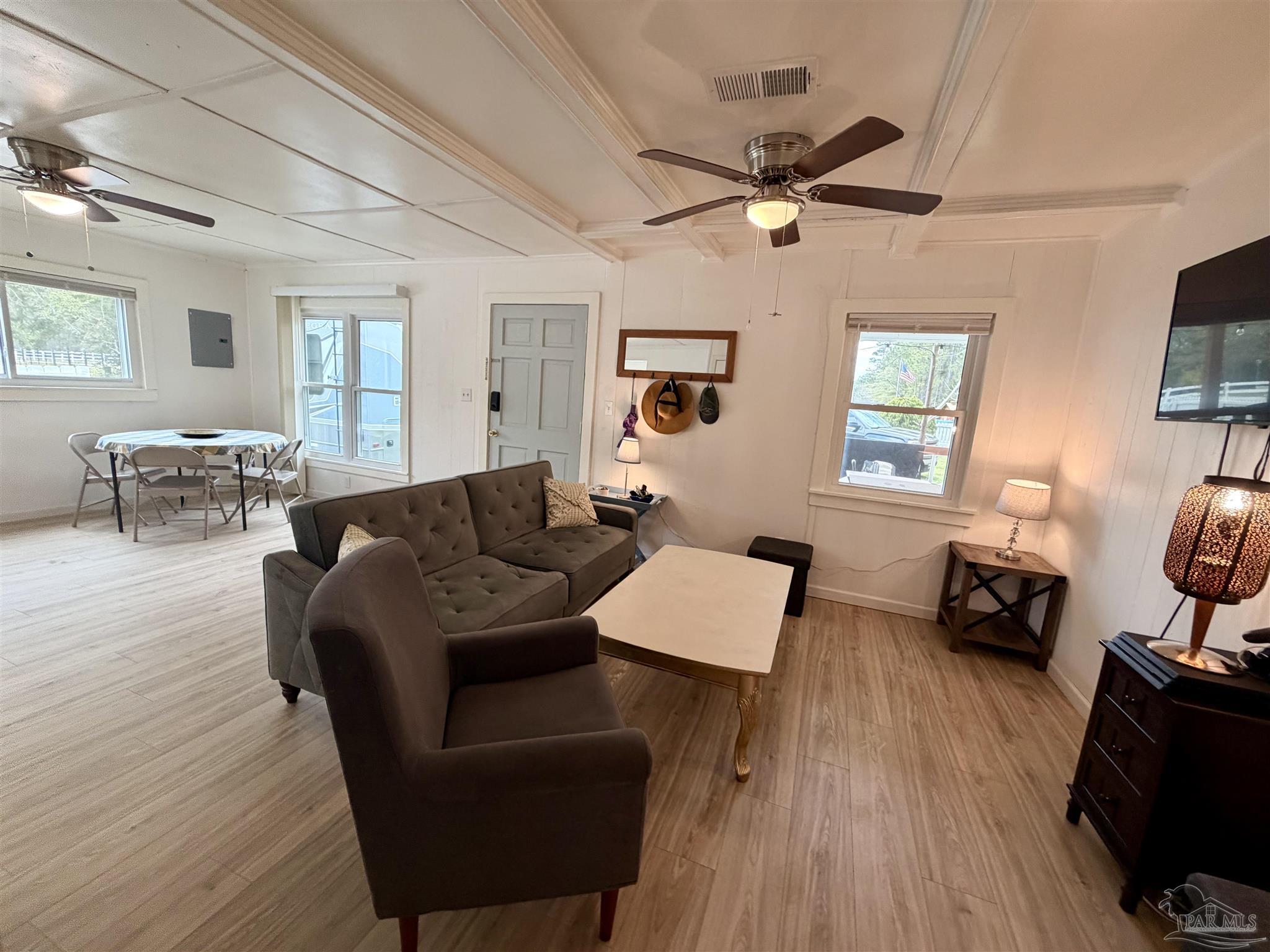 8816 Gibson Road Molino, FL 32577 - Photo 16 of 61 a living room with furniture and a wooden floor
