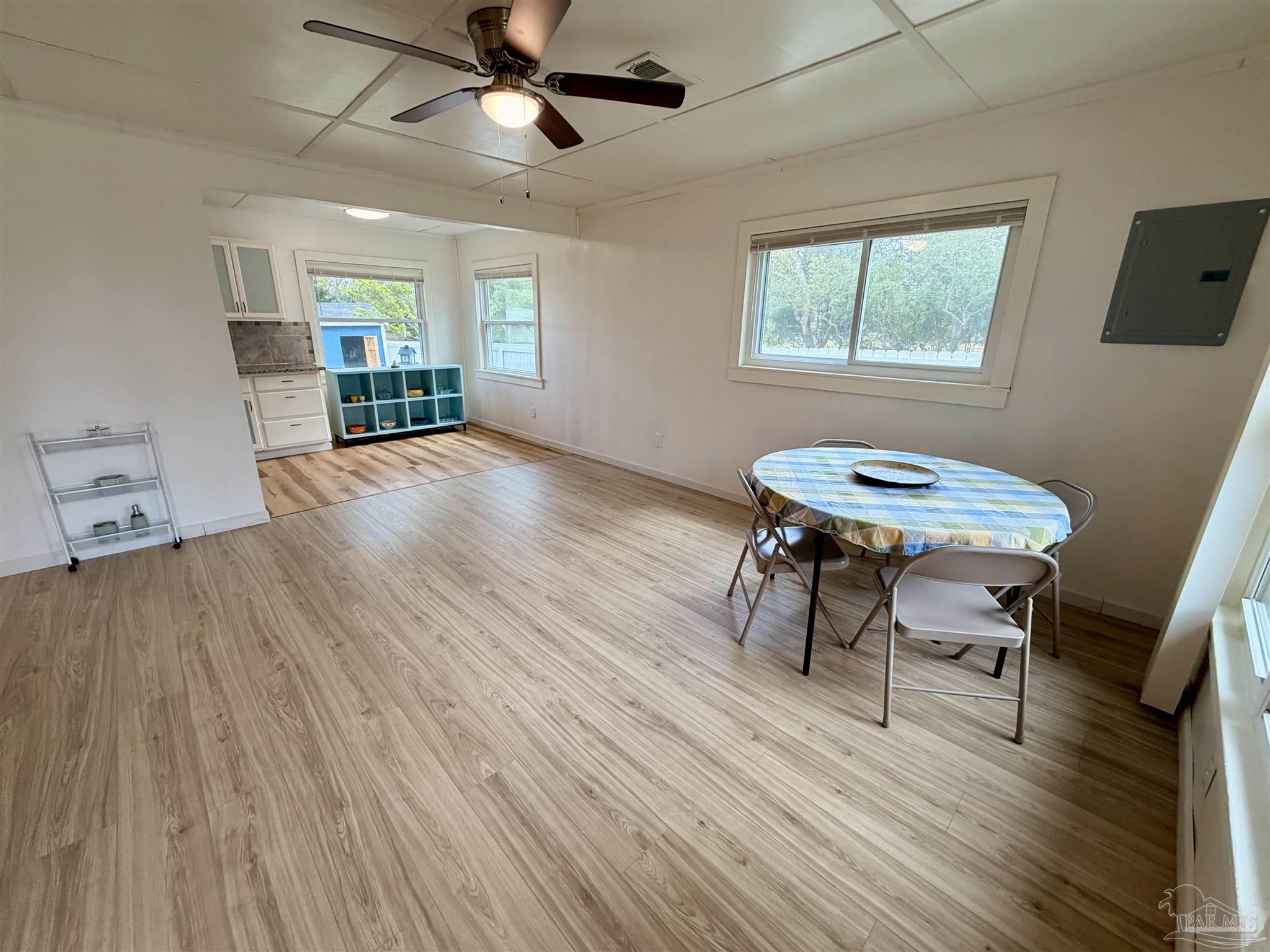 8816 Gibson Road Molino, FL 32577 - Photo 17 of 61 a view of a room with furniture window and wooden floor