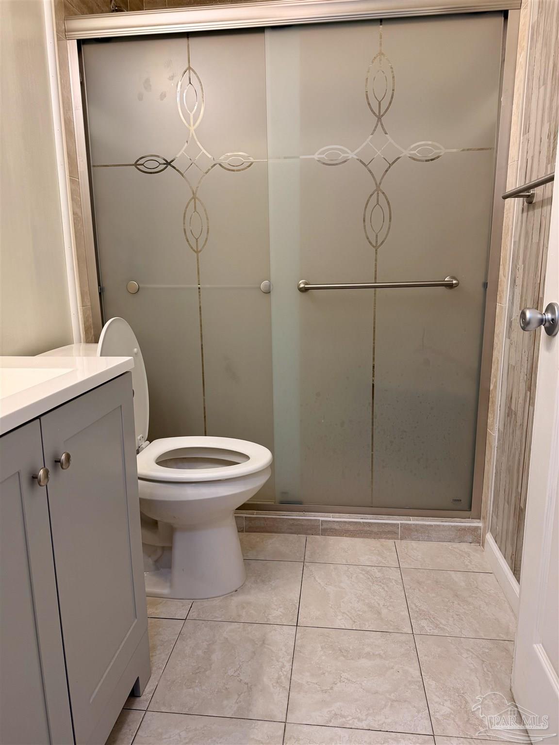 8816 Gibson Road Molino, FL 32577 - Photo 29 of 61 a bathroom with a toilet and a shower
