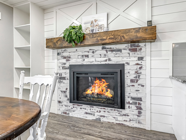 523 South Main Street Payson, UT 84651 - Photo 16 of 41 White-washed brick fireplace with a heavy timber mantel