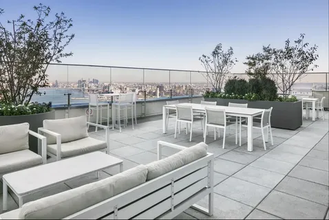 a view of a terrace with couches table and chairs