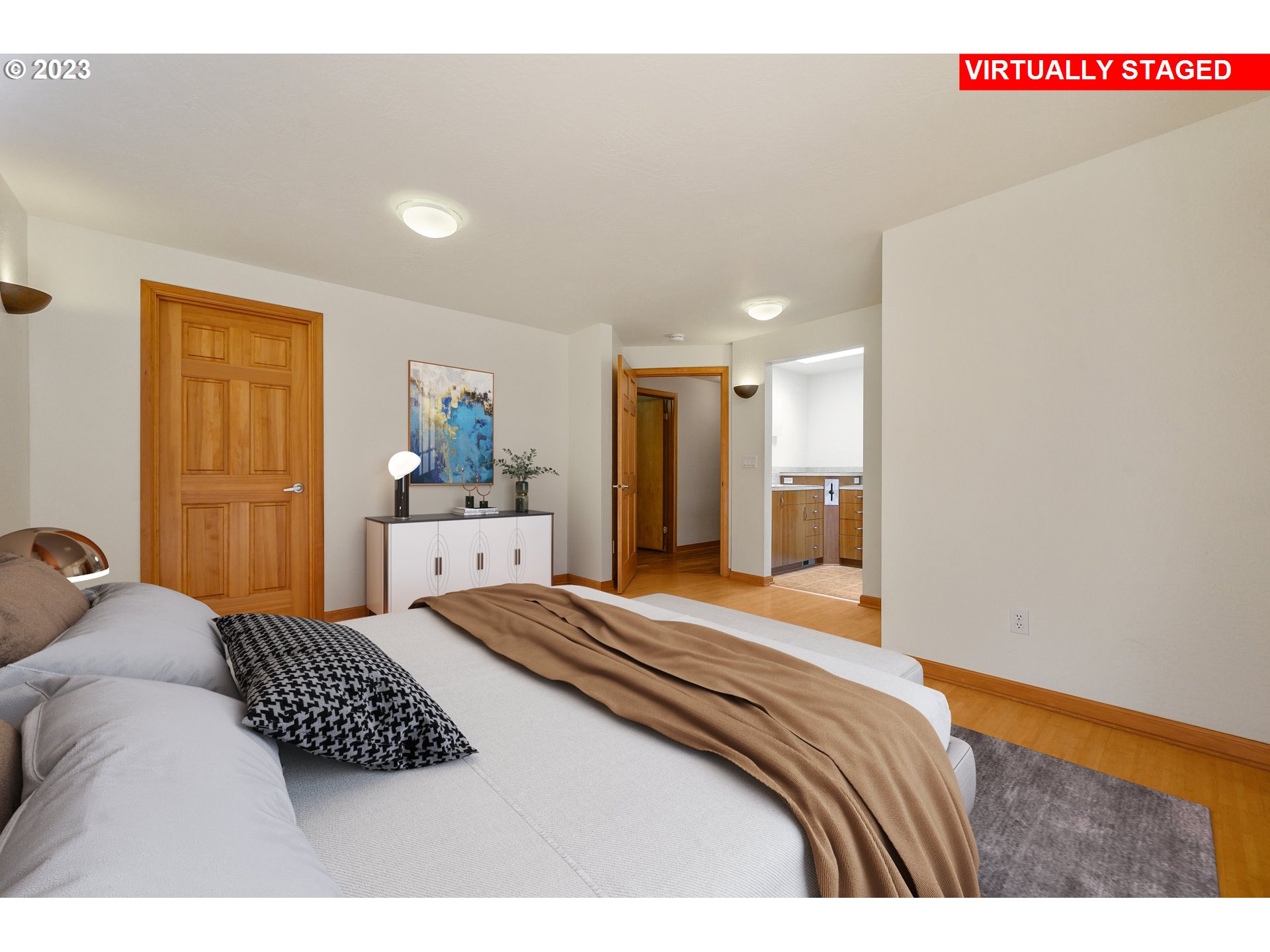 15775 Oakdale Road Dallas, OR 97338 - Photo 15 of 32 a bedroom with a bed and a lamp