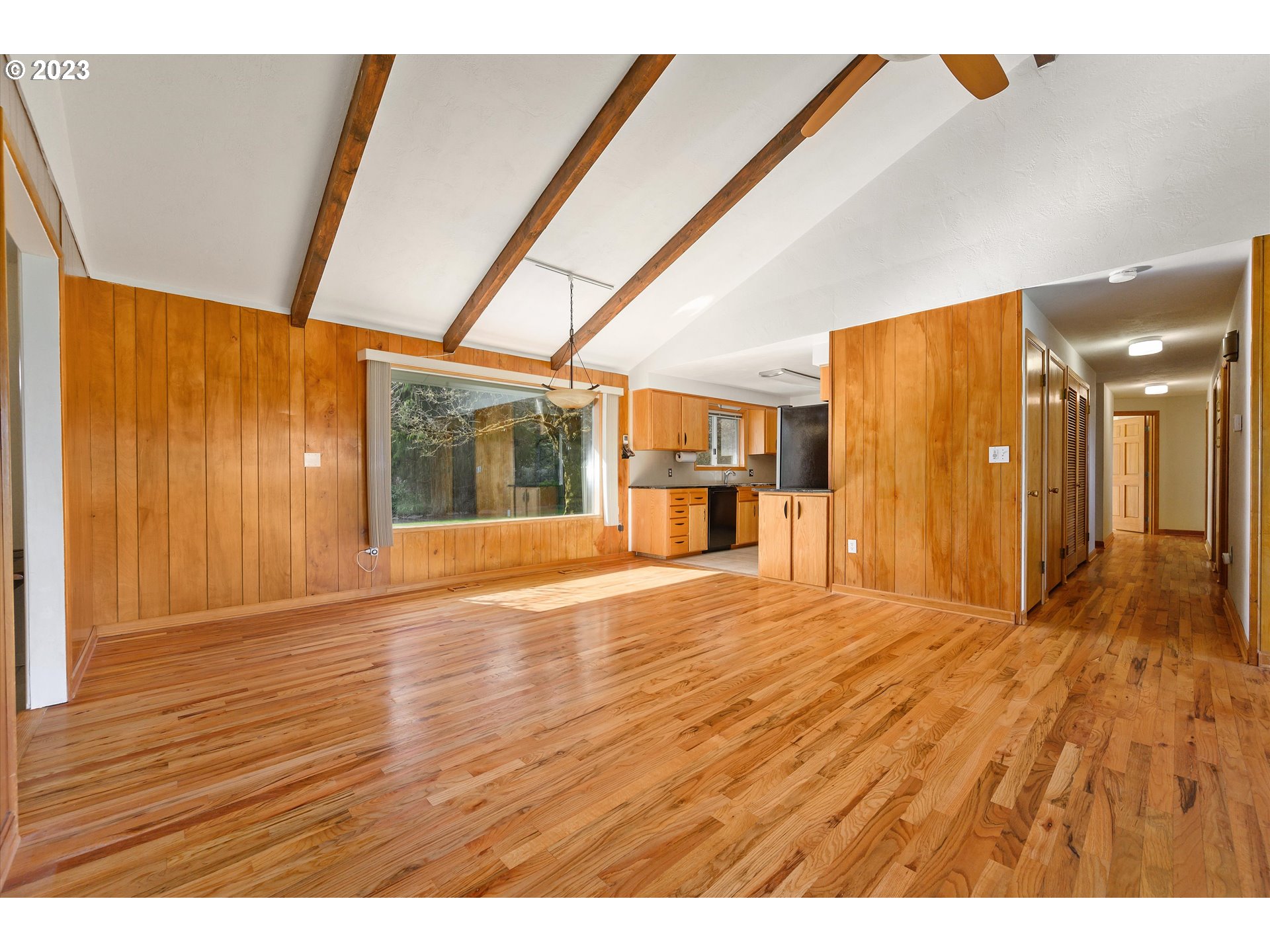 15775 Oakdale Road Dallas, OR 97338 - Photo 9 of 32 a empty room with wooden floor and windows