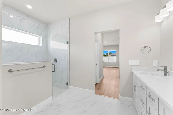 a bathroom with a sink and mirror