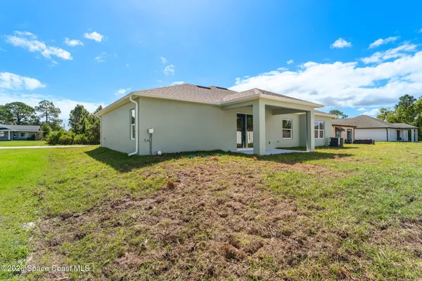 a house with yard in front of it