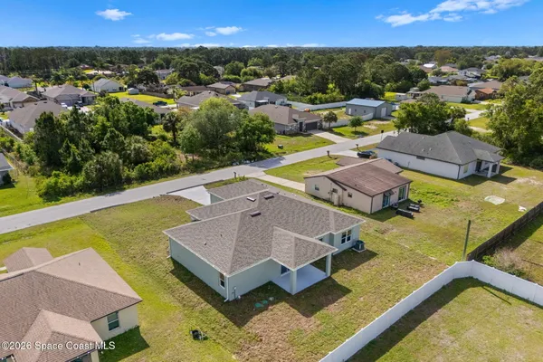an aerial view of a house with swimming pool