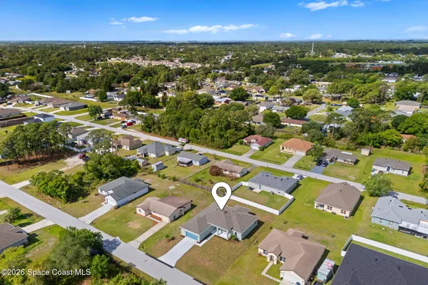 an aerial view of residential houses with outdoor space