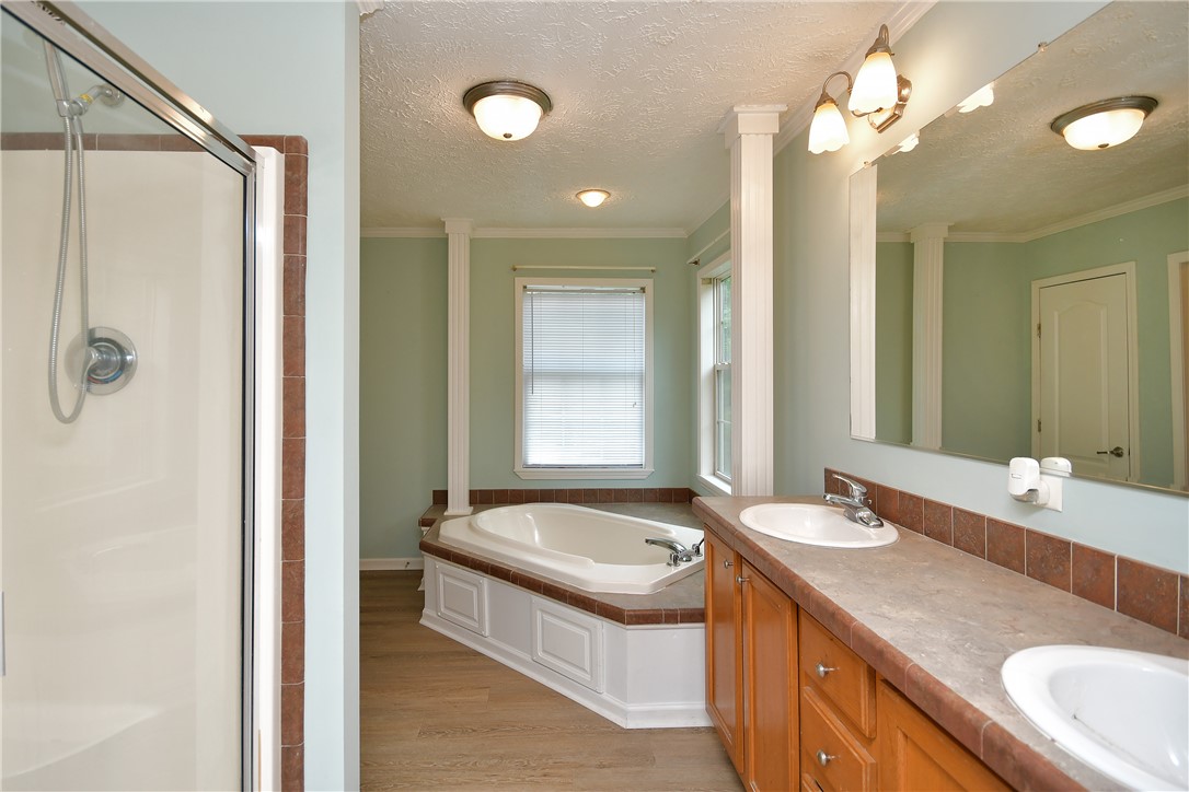 579 Daventon Road Honea Path, SC 29654 - Photo 13 of 44 Double vanities and a deep soaking tub create a restful bathroom retreat.
