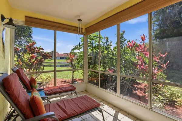 a view of a chairs and table in the patio