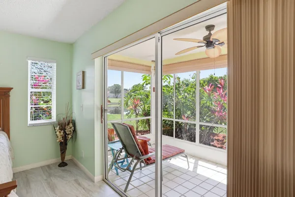 a balcony with table and chairs