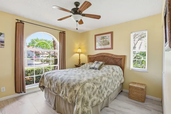 a bedroom with a large bed and a window