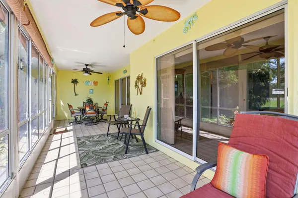 a view of a patio with a table and chairs