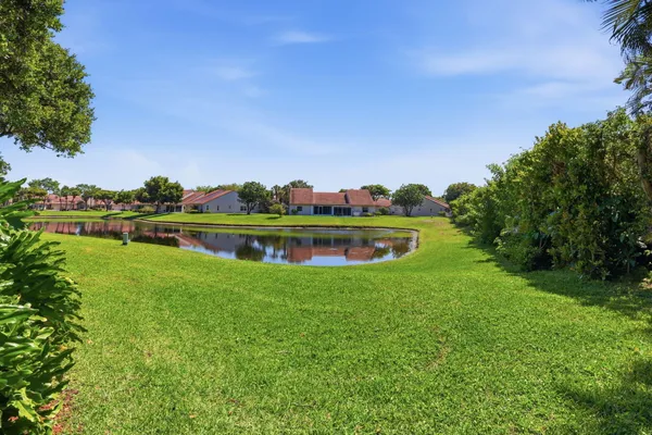 a view of a golf course with a lake