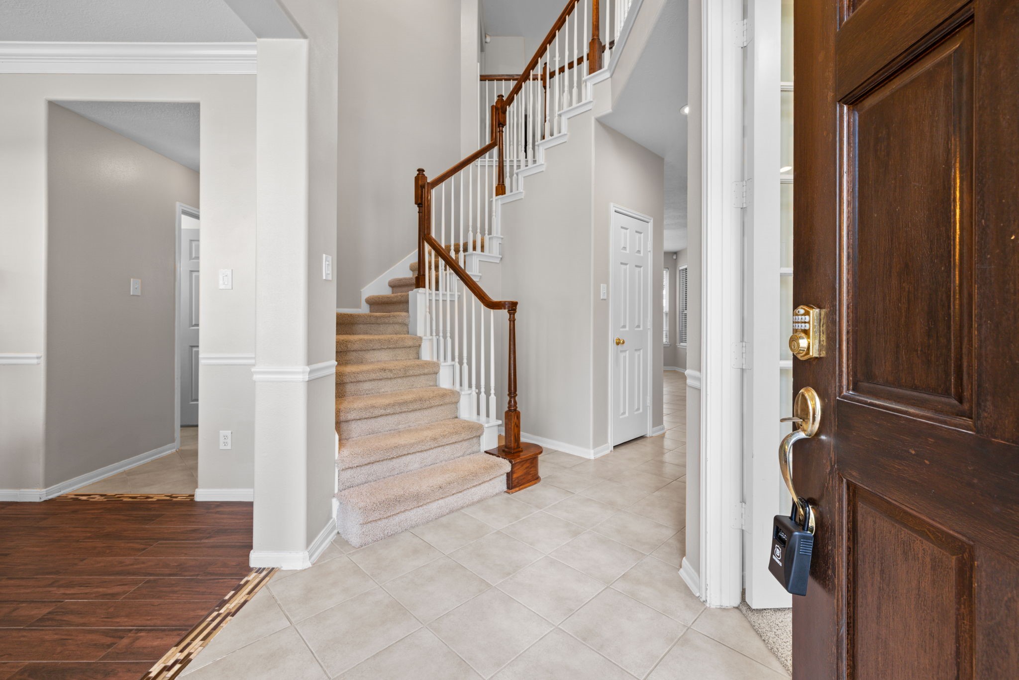 19114 Emory Trail Spring, TX 77388 - Photo 5 of 44 a view of a hallway with wooden floor and staircase