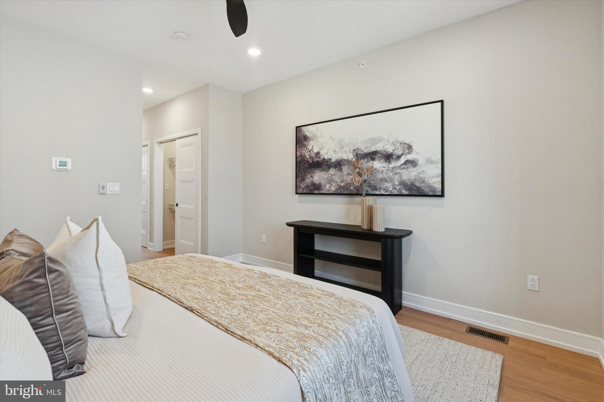 1620 North Randolph Street Philadelphia, PA 19122 - Photo 18 of 25 a bedroom with a bed and a painting on the wall