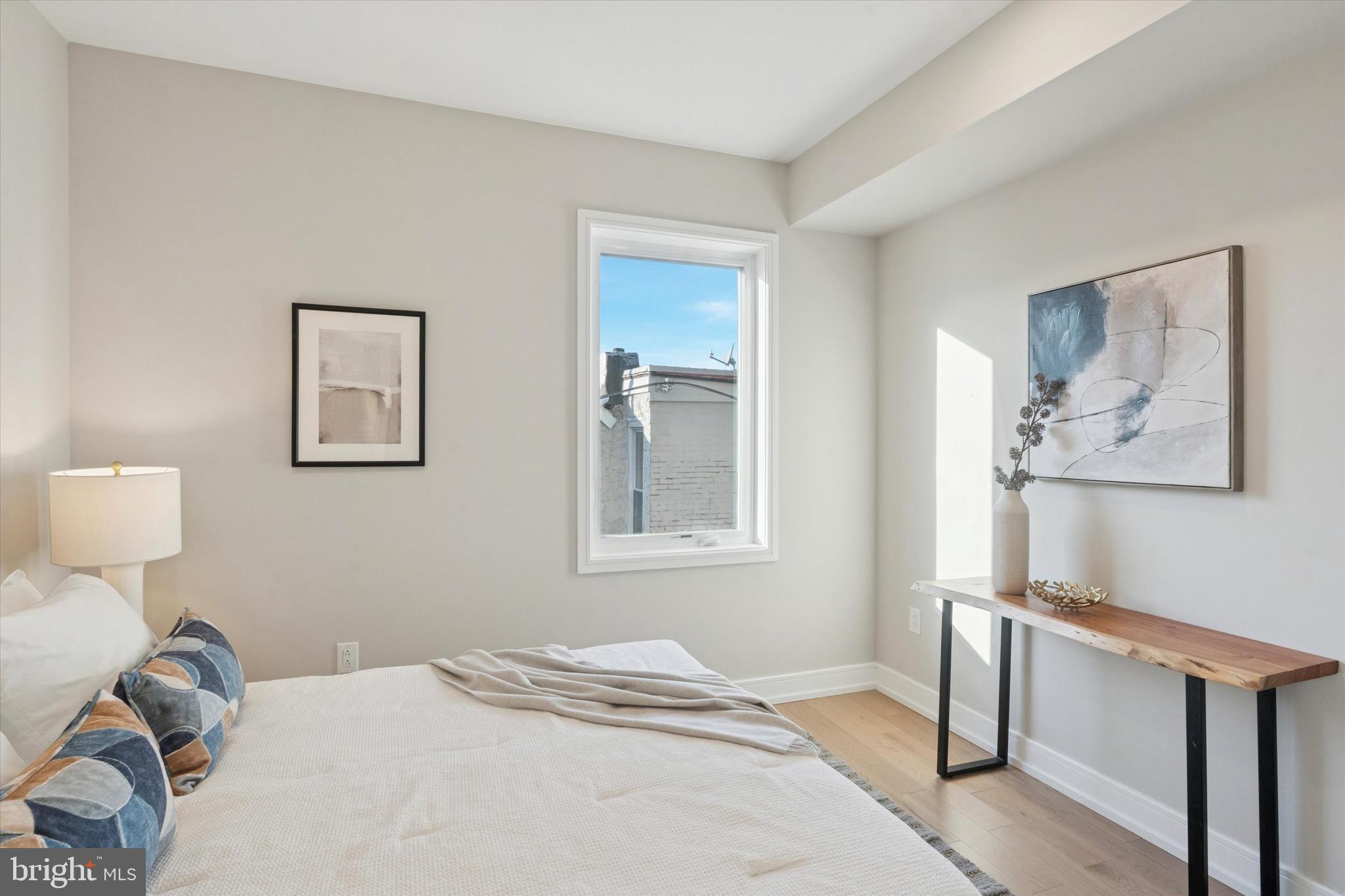 1620 North Randolph Street Philadelphia, PA 19122 - Photo 7 of 25 a bedroom with a bed and wooden floor