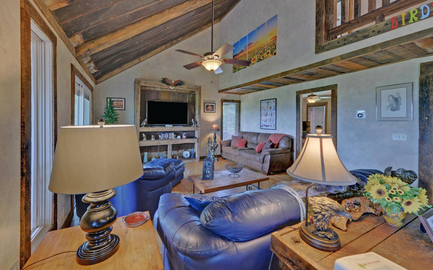 624 Talona Mountain Road Ellijay, GA 30536 - Photo 11 of 49 a living room with furniture and a flat screen tv