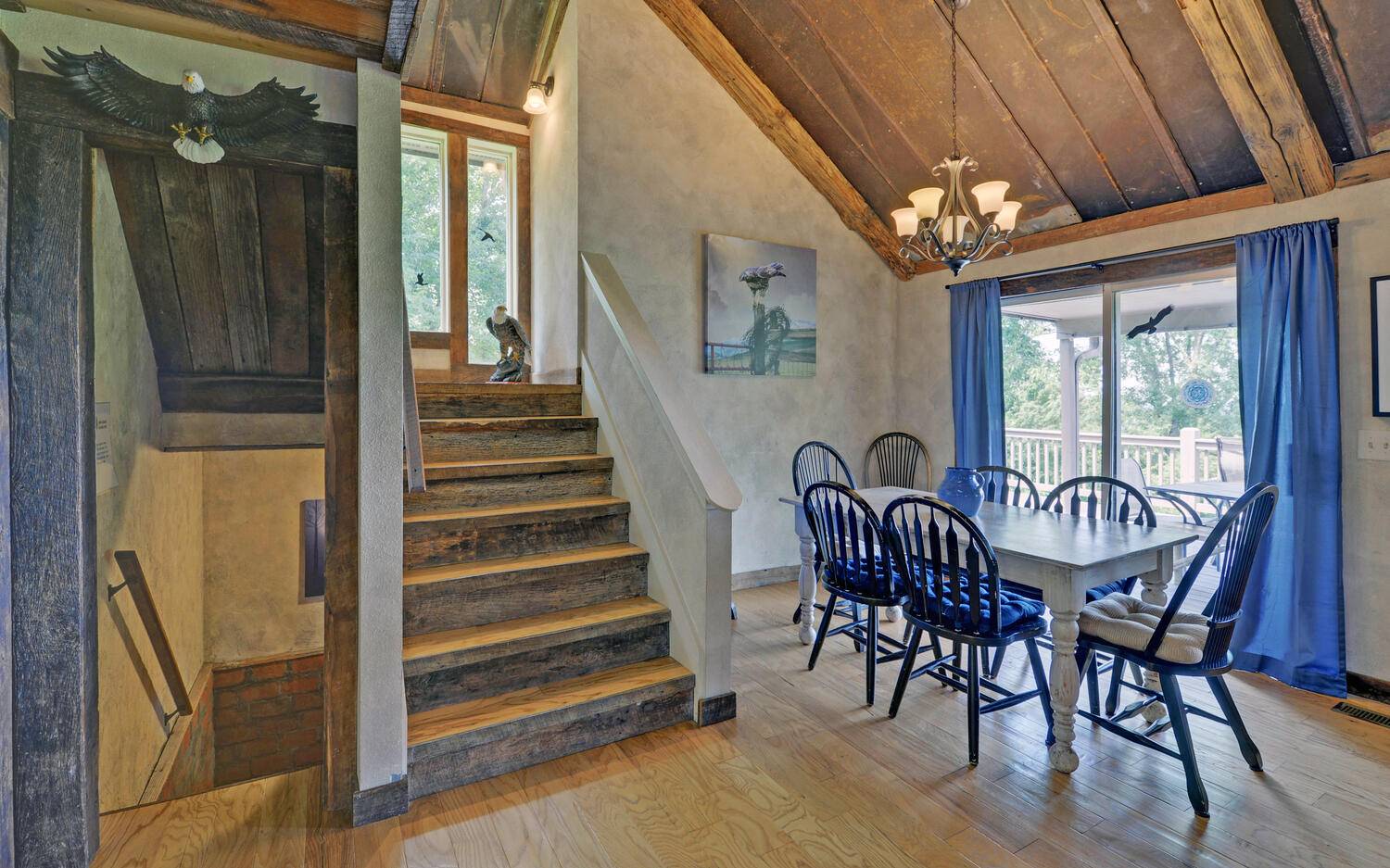 624 Talona Mountain Road Ellijay, GA 30536 - Photo 14 of 49 a view of a dining room with furniture window and wooden floor
