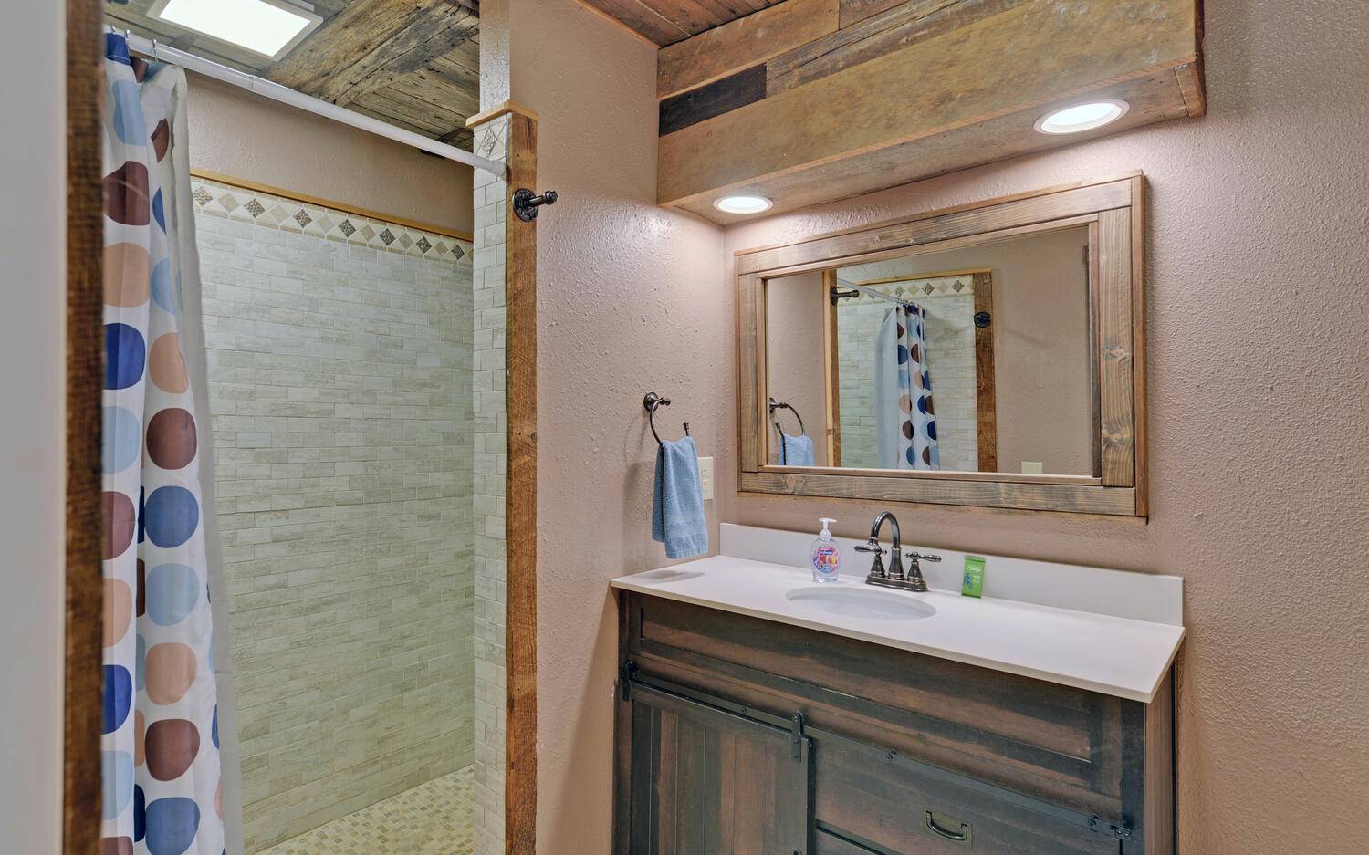 624 Talona Mountain Road Ellijay, GA 30536 - Photo 19 of 49 a bathroom with a sink vanity and a mirror