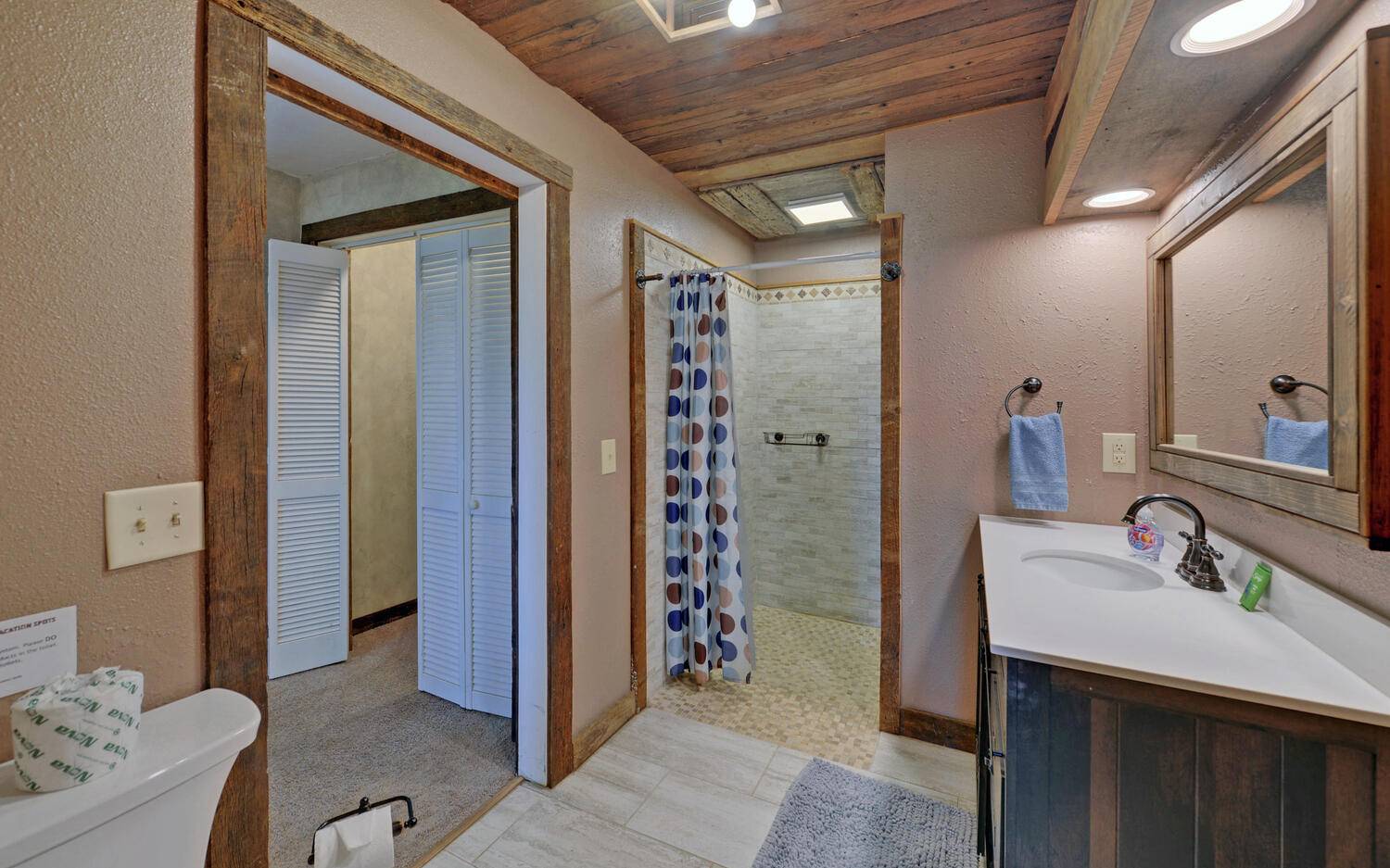 624 Talona Mountain Road Ellijay, GA 30536 - Photo 20 of 49 a bathroom with a sink and a mirror