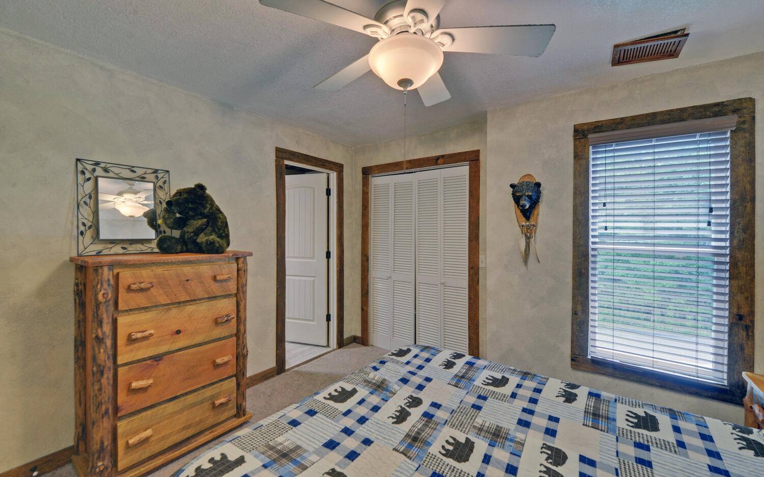624 Talona Mountain Road Ellijay, GA 30536 - Photo 35 of 49 a bedroom with a bed and a dresser in it