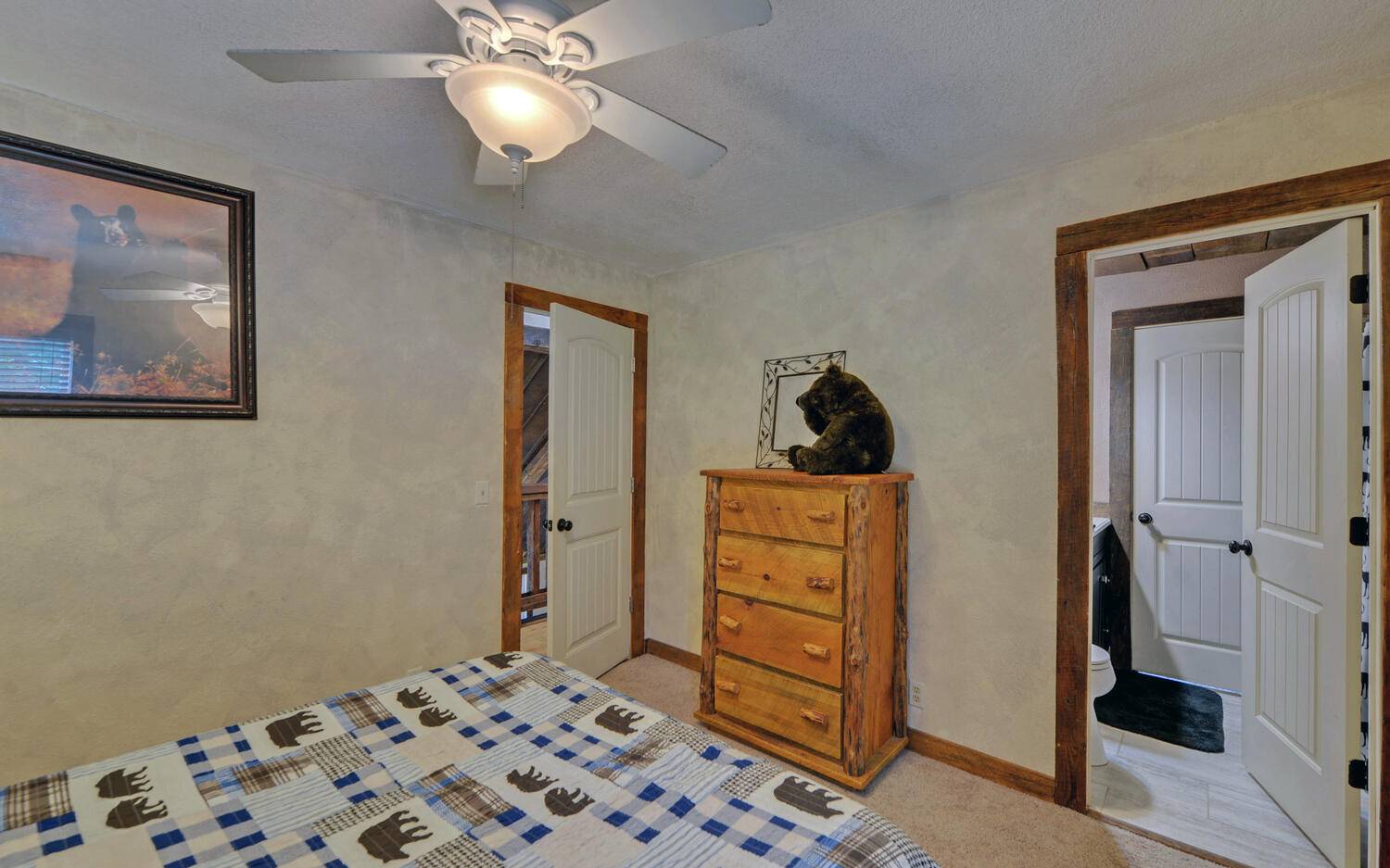 624 Talona Mountain Road Ellijay, GA 30536 - Photo 36 of 49 a bedroom with a bed and cabinets