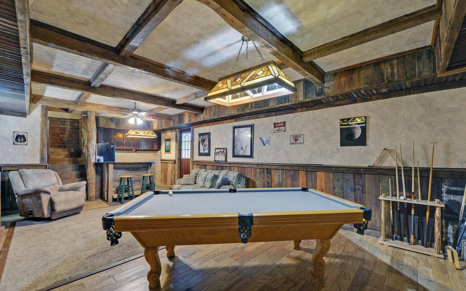 624 Talona Mountain Road Ellijay, GA 30536 - Photo 6 of 49 a living room with furniture a flat screen tv and a table