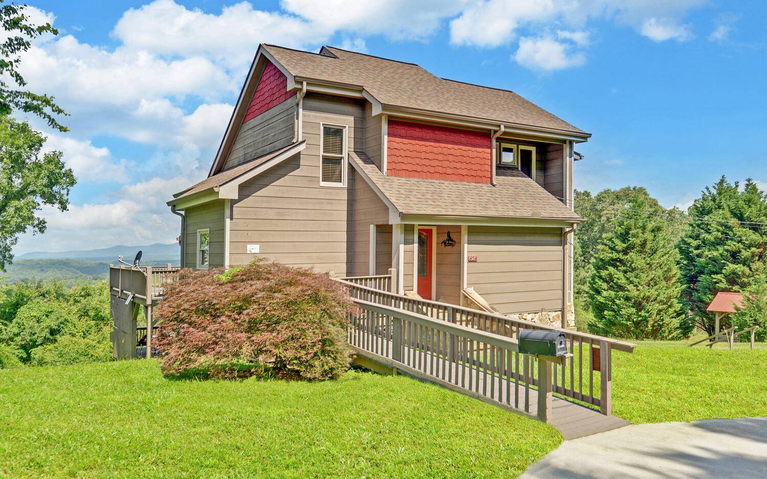 624 Talona Mountain Road Ellijay, GA 30536 - Photo 8 of 49 a front view of a house with a garden