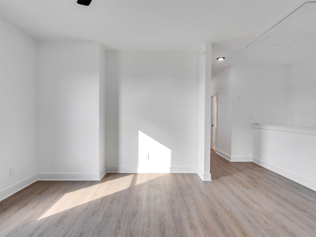 4421 Reed Road, Unit A AND B Houston, TX 77051 - Photo 14 of 27 an empty room with wooden floor and windows