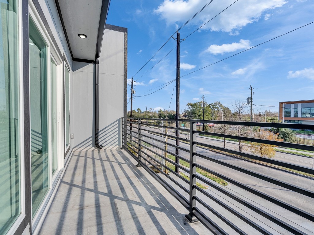 4421 Reed Road, Unit A AND B Houston, TX 77051 - Photo 20 of 27 a view of a balcony with wooden floor
