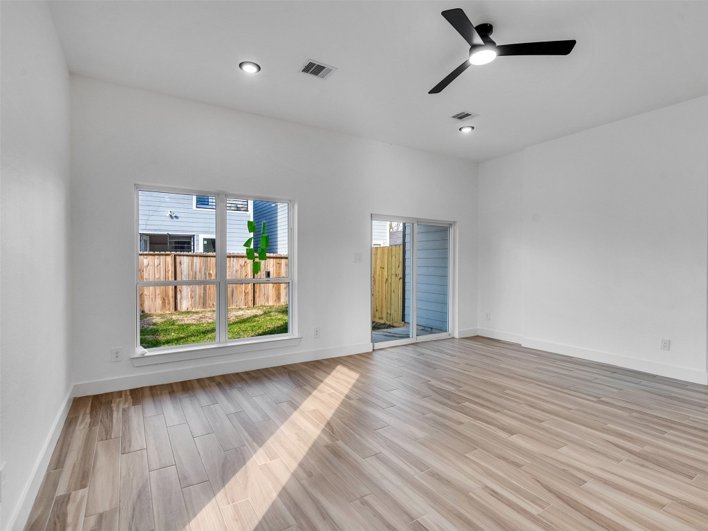 4421 Reed Road, Unit A AND B Houston, TX 77051 - Photo 5 of 27 an empty room with window and wooden floor