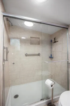 a bathroom with a shower and toilet
