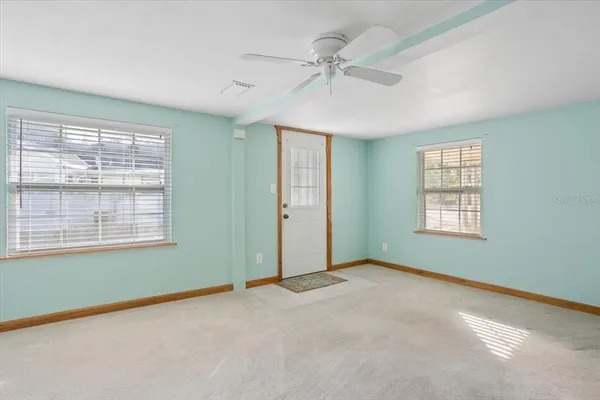 a view of an empty room with a window
