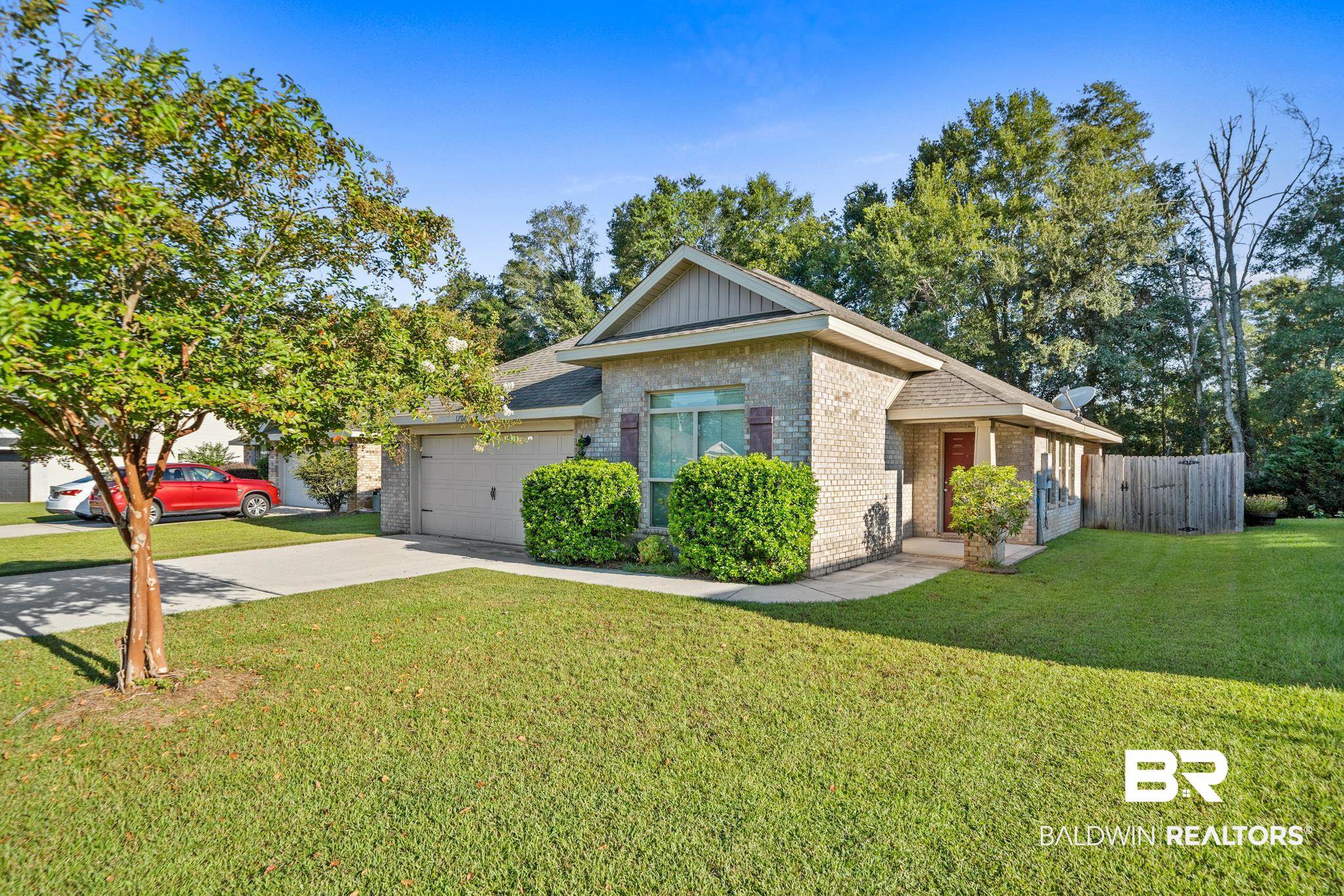17069 Russet Court Foley, AL 36535 - Photo 27 of 27 View of front of home with a garage and a front lawn