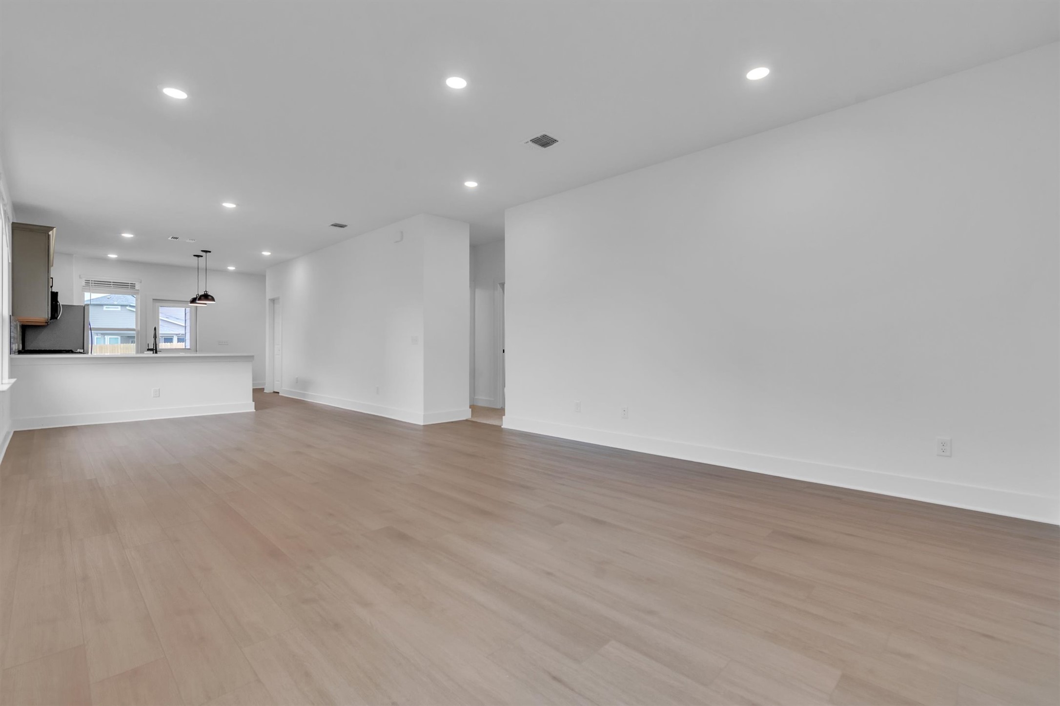 368 Bridge Deck Loop Kyle, TX 78640 - Photo 7 of 40 Unfurnished living room with recessed lighting, light wood-style floors, and baseboards
