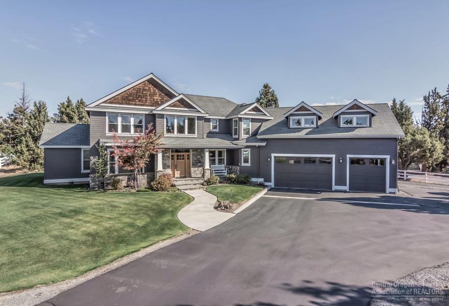 63528 Old Deschutes Road Bend, OR 97701 - Photo 1 of 25 a front view of a house with yard and parking