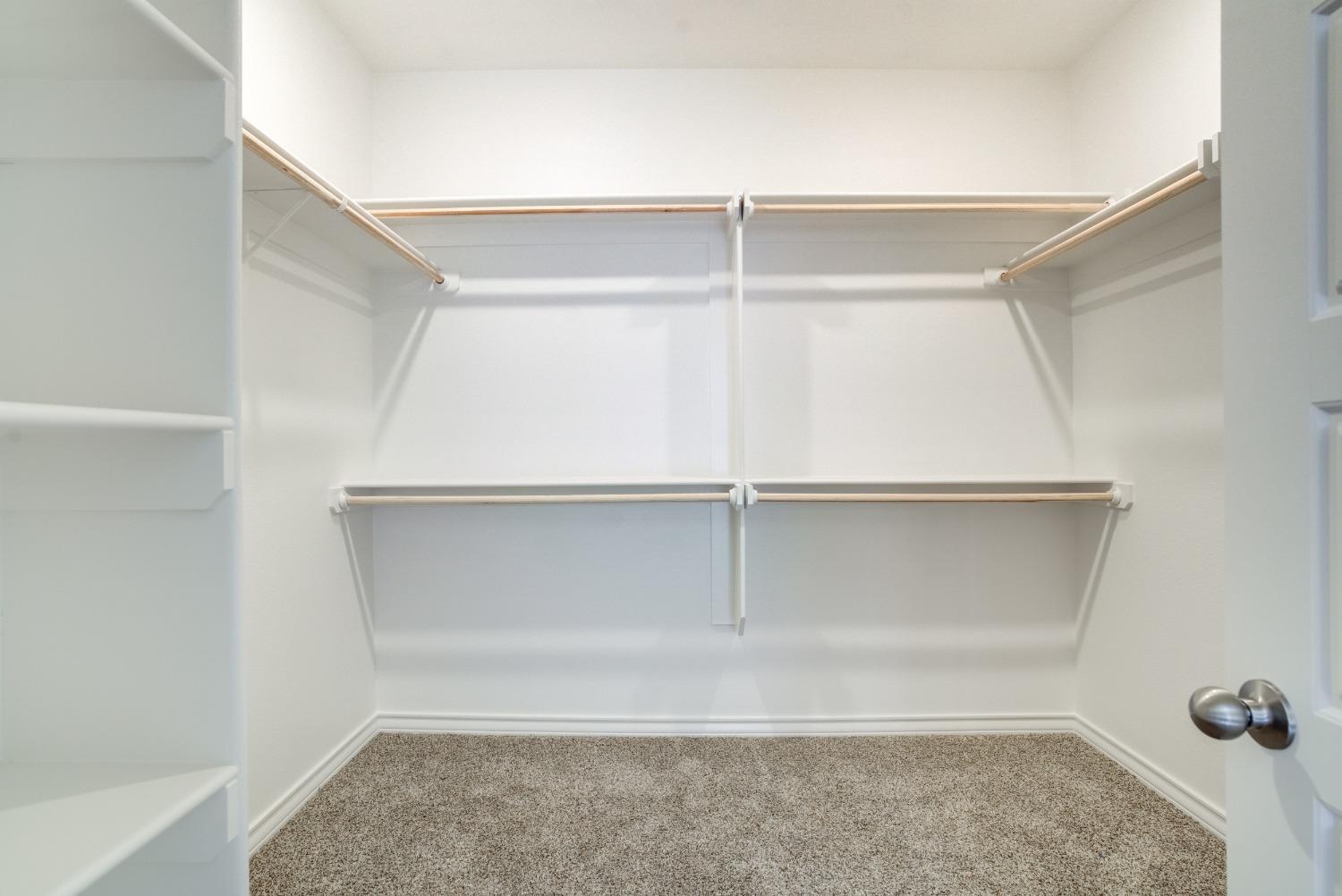 7602 60th Street Lubbock, TX 79407 - Photo 20 of 33 a view of an empty walk in closet