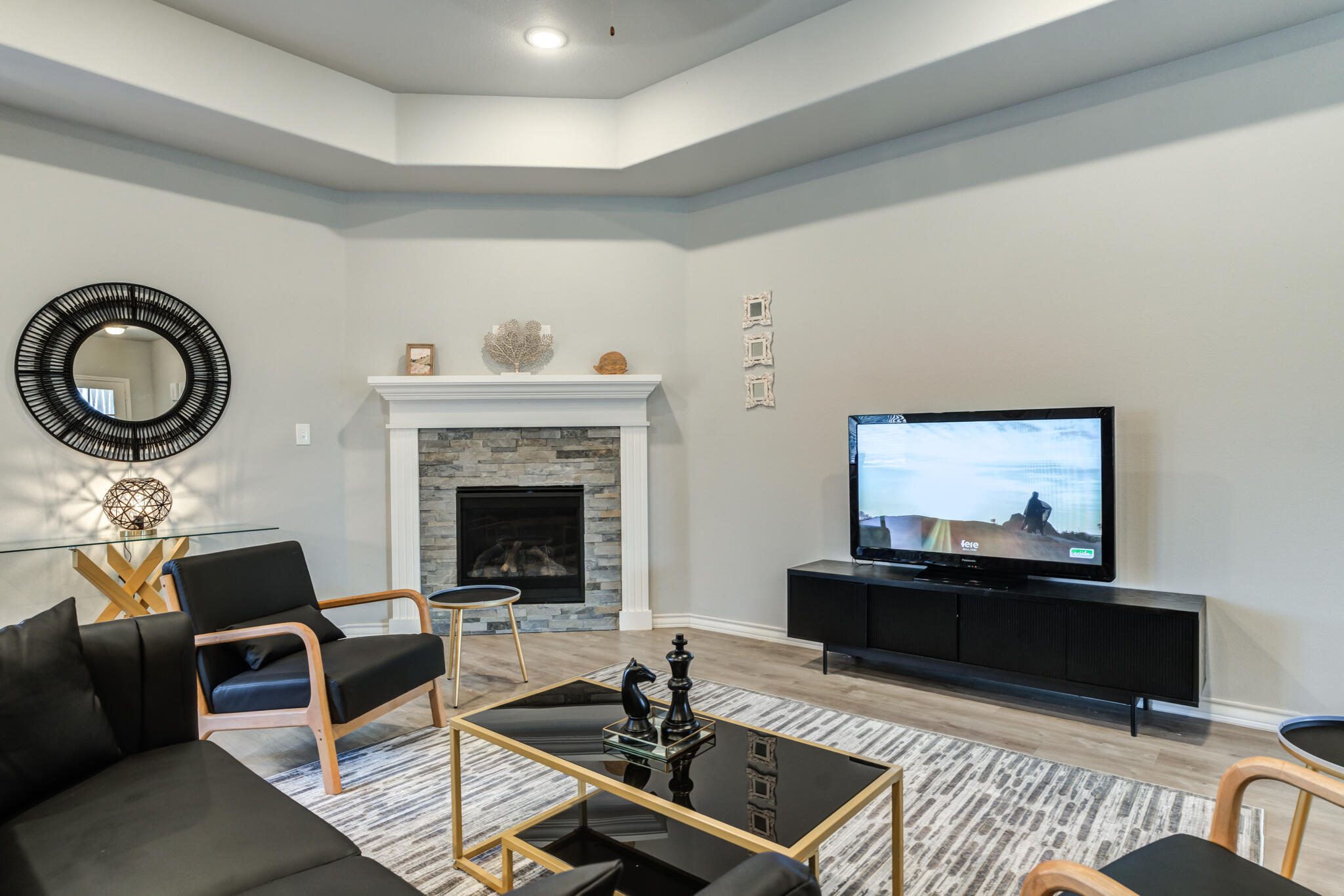 7602 60th Street Lubbock, TX 79407 - Photo 28 of 33 a living room with furniture and a fireplace