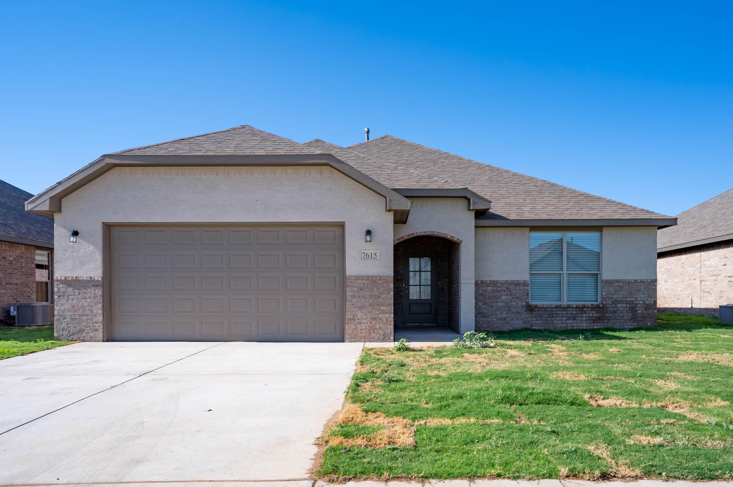 7602 60th Street Lubbock, TX 79407 - Photo 7 of 33 a front view of a house with a yard