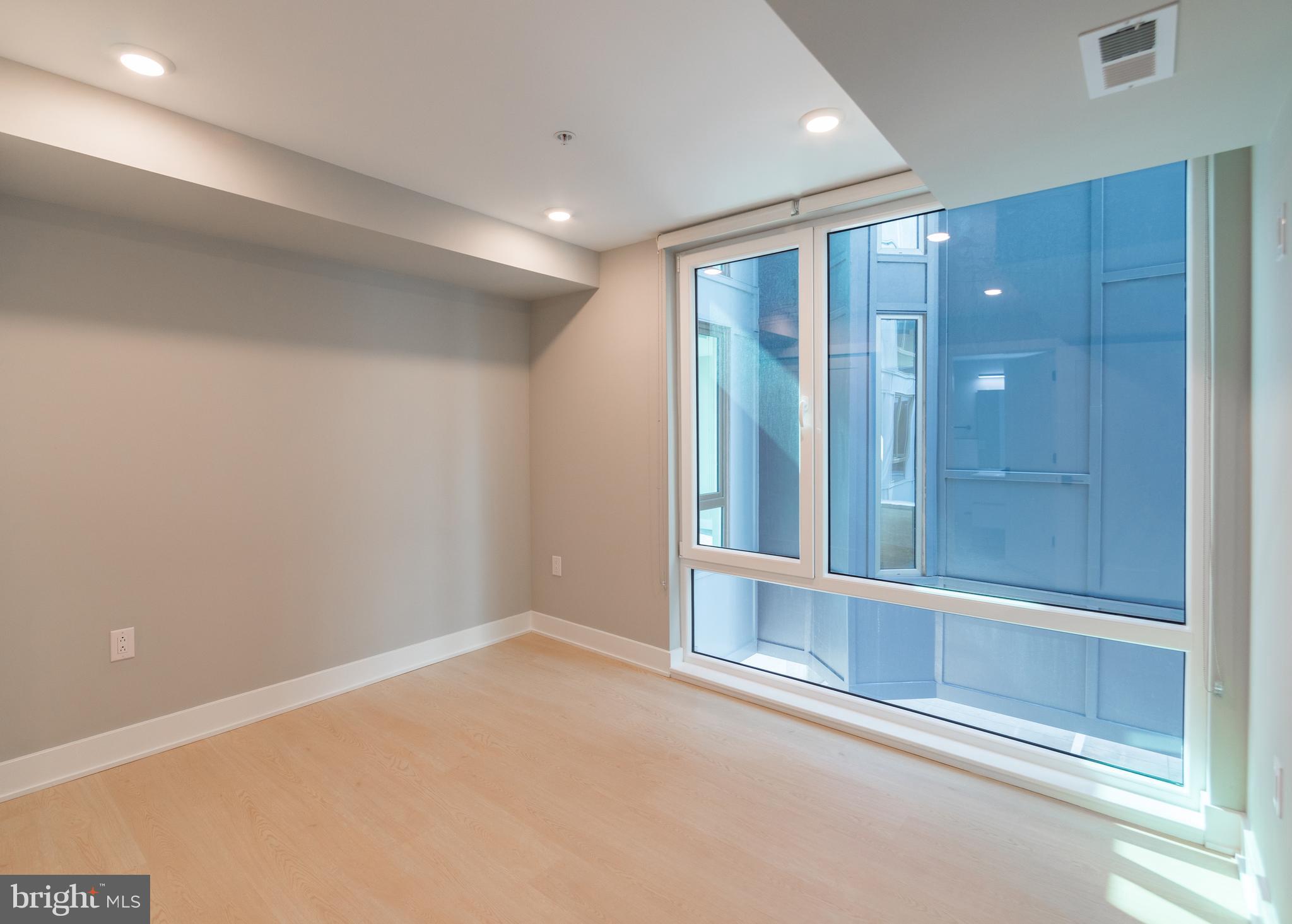 6604 Ridge Avenue, Unit 210 Philadelphia, PA 19128 - Photo 11 of 11 a view of an empty room with a window