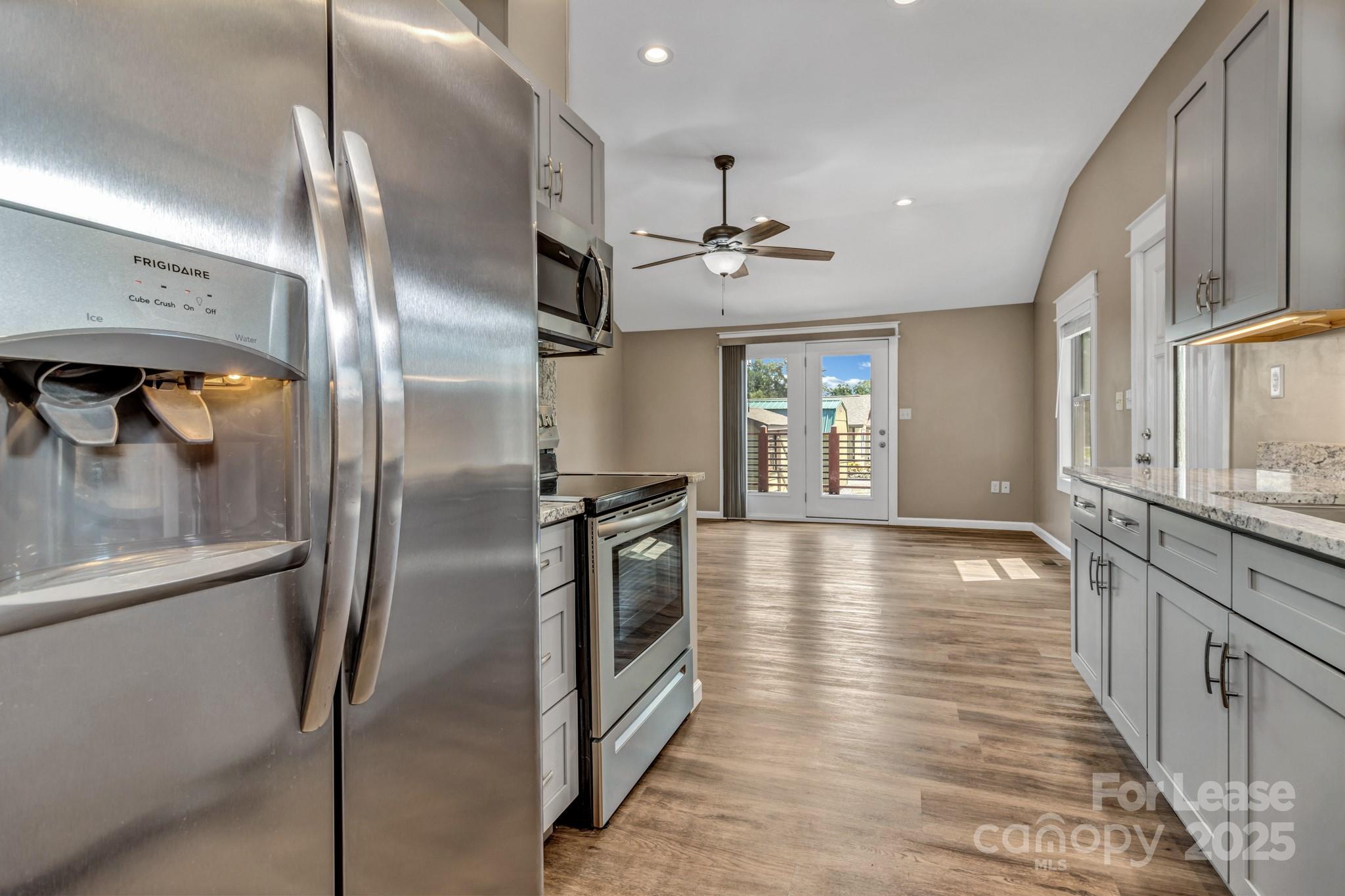 150 Oak Hill Road Candler, NC 28715 - Photo 18 of 44 a view of a refrigerator in kitchen and windows