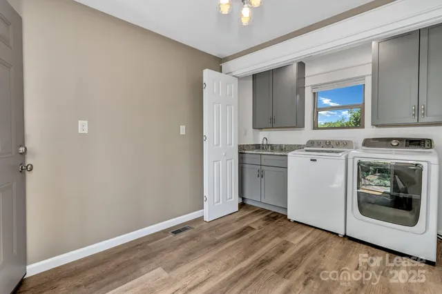 a view of a kitchen with a sink cabinets and a window